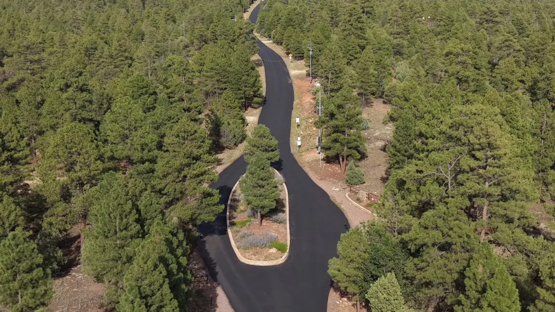 Aerial view of the entrance road through the forest at Mogollon Ranch